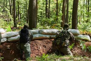two elite soldiers stand guard, resolute and vigilant, defending the area against attacking enemies with tactical precision and unwavering determination, showcasing their role as skilled protectors in photo
