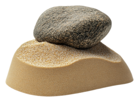 A smooth stone resting on a sandy mound, cut out - stock . png