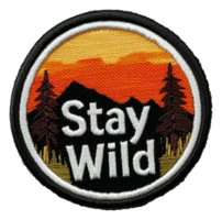 Embroidered patch featuring a sunset and mountains, cut out - stock . png