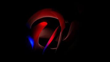 A red and blue abstract design on a black background video