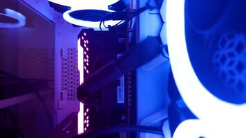 A computer case with blue and purple lights photo