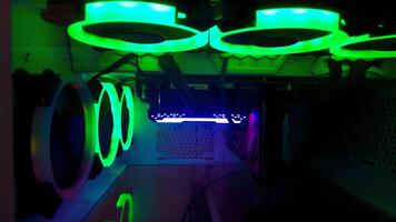 A computer case with green and blue lights photo