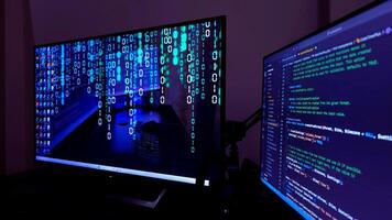 Two monitors with a computer screen on each photo