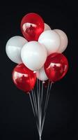 A big bunch of red and white balloons on a black background, Festive party atmosphere. Celebrations photo