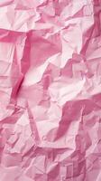 Close-up of wrinkled pink paper texture, ideal for scrapbooking and crafting. Top view photo