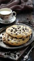 Chocolate chip cookies and cup of milk. Sweet snack Home baking. Large soft cookie photo
