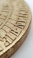 Close-up of coin edge. serrations and detailed texture pattern of golden coins in macro view photo