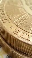 Close-up of coin edge. serrations and detailed texture pattern of golden coins in macro view photo