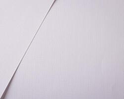 White linen fabric background with a woven texture and smooth, natural material. Soft and elegant photo