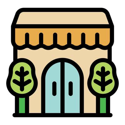Small business building facade with canopy and trees