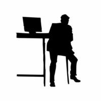 A silhouette of a man sitting at a desk with a computer vector
