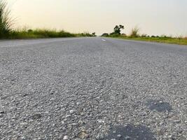 Road between the fields with the sky photo