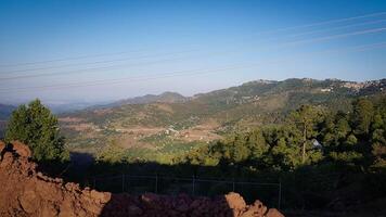 Beautiful Over the Mountain View with bunch of trees photo
