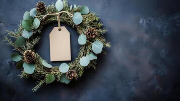 A blank tag is attached to a vibrant Christmas wreath photo