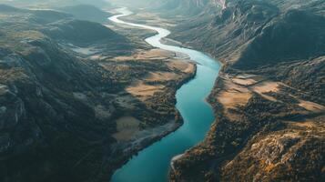 Aerial View of a River Winding Through a Mountain Gorge photo