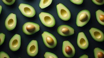 Aerial view of halved avocados on a dark background photo