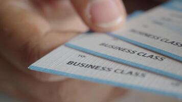 A comprehensive collection of valuable Business Class Flight Tickets securely held in a hand video