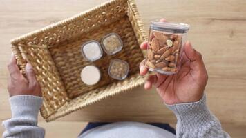 Here is a stylish basket filled with a delightful assortment of nuts and snacks to enjoy video