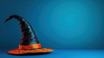 Halloween Witch Hat on a blue background photo