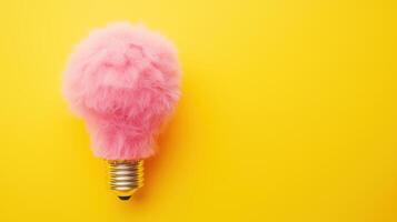 Creative layout made of light bulb made of fluffy pink fur photo