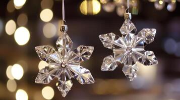 Beautiful hanging crystal snowflake decorations sparkling in the light photo
