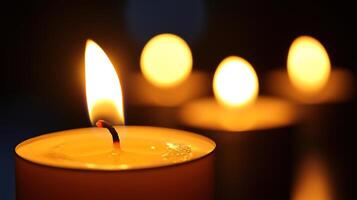 Several candles burning with limited depth of field photo