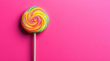 Lollipop on one stick on one pink boneckground photo
