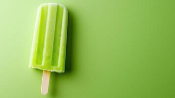 Green popsicle on a green background photo