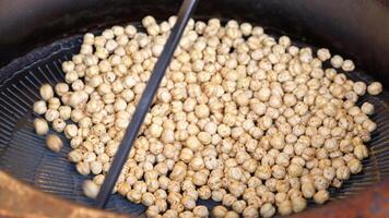 Roasting Chickpeas Using a Traditional Cooking Vessel for Authentic Flavor and Texture video