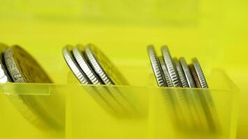 A yellow box with coins in it video