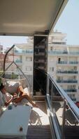 Taking a moment to unwind and relax on a lovely balcony while enjoying a breathtaking, scenic view video