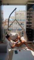 Enjoy a relaxing balcony with stunning views and cozy seating for maximum enjoyment video