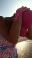 Enjoying a Sunny Day at the Beach in Bright and Colorful Swimwear for Endless Fun video