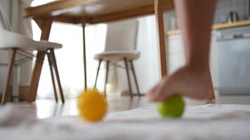 Participating in a Joyful and Colorful Playtime Experience Within a Cozy Kitchen Space video