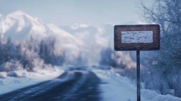 Wooden brown plank sign in winter road guiding direction of destination photo
