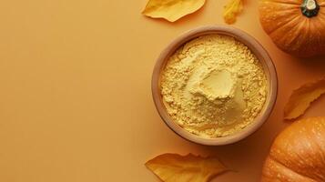 Pumpkin flour on brown wooden bowl and some vegetable for baking, gluten free copy space photo