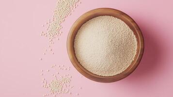 Quinoa flour on brown wooden bowl and some Quinoa seeds for baking, gluten free copy space photo
