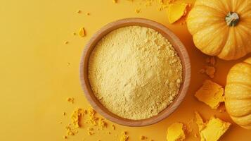 Pumpkin flour on brown wooden bowl and some vegetable for baking, gluten free copy space photo