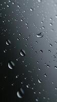 Waterdrop bubble splashing rounded on black blurred background photo