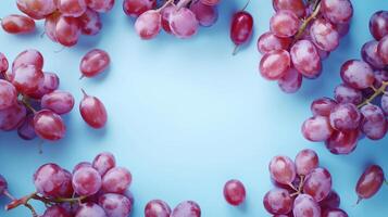 Grape purple fruit circular arrangement copy space black in center blue background photo