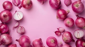 Onion organic fresh vegetable seasoning copy space in middle and pink background photo