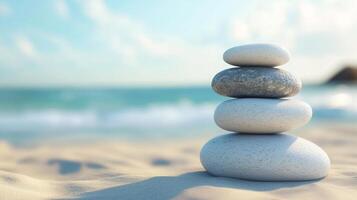 Stack balance Zen grey stones on beach sand with sun light sky landscape view photo