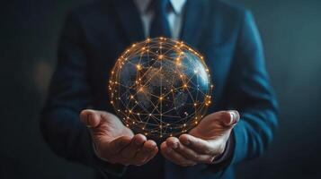 Businessman holding a globe with network lines and dots photo