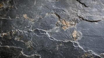 A close up of a black stone wall photo