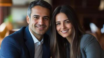 A man and woman are smiling for the camera photo