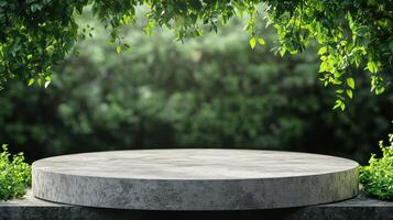 Round concrete pedestal in front of green trees photo