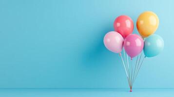 Colorful balloons on blue background photo