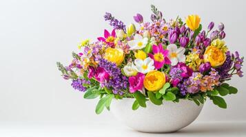 A vase filled with colorful flowers on a white background photo