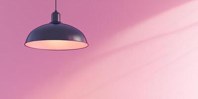 A black light hanging from a ceiling over a pink wall photo