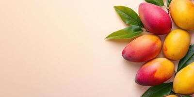 Mango fruit on a light pink background photo